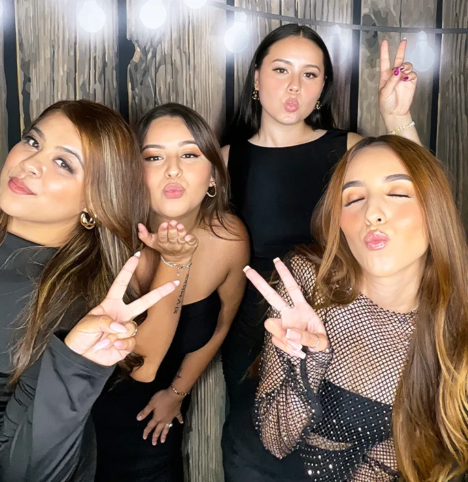 teen girls posing at sweet sixteen photo booth in Carson California