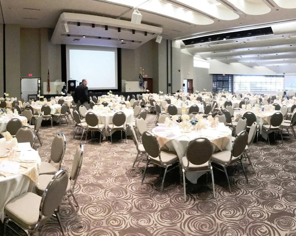 Interior of Carson Event Center with tables and chairs set up for an event in Carson California