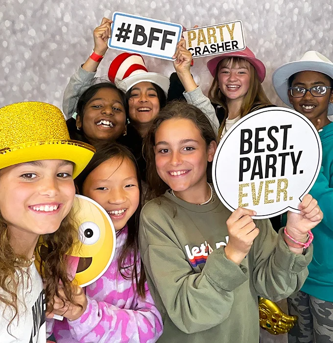 kids posing with best party ever sign at photo booth in Carson California