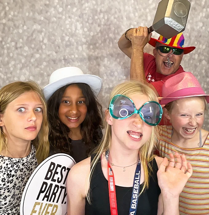 kids wearing colorful photo booth props at birthday party photo booth in Carson California